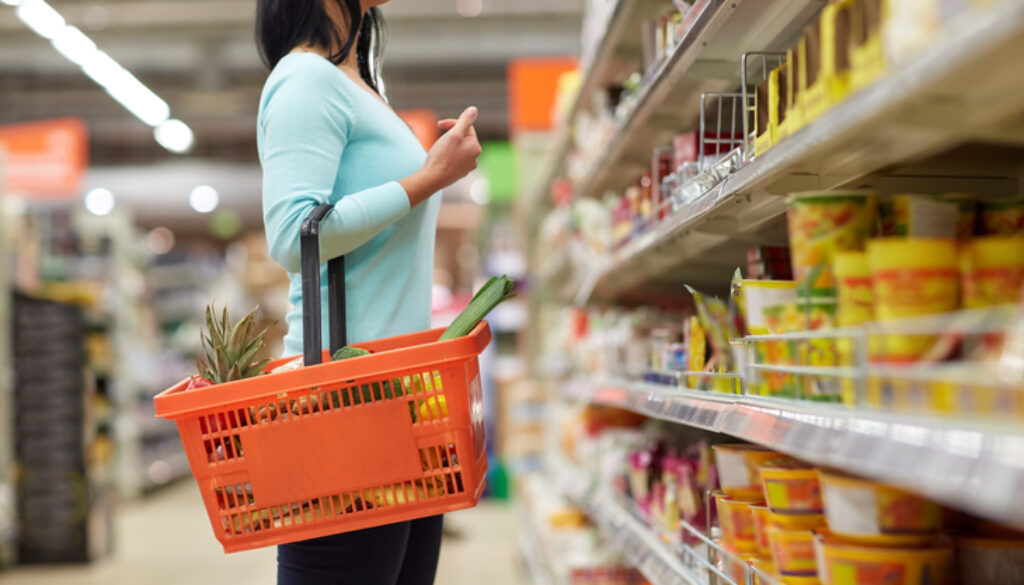 Woman With A Grocery Basket Deciding Which Groceries To Buy How To Get Your Food Product In Stores