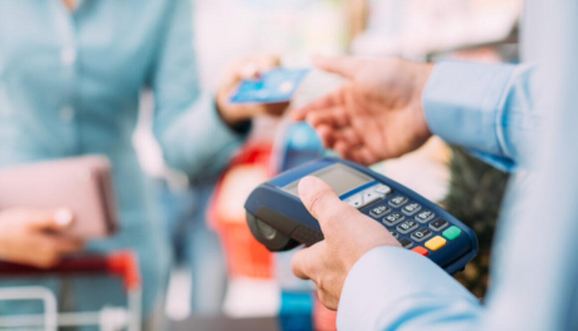 Woman At The Store Checkout