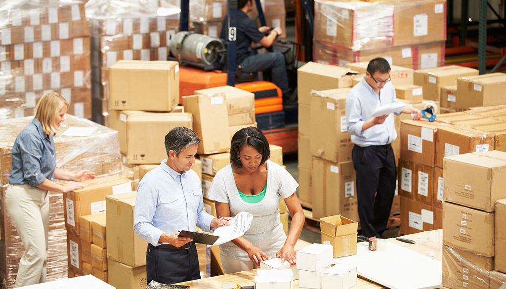Workers In A Warehouse Working Together To Pack Products Order Fulfillment Services